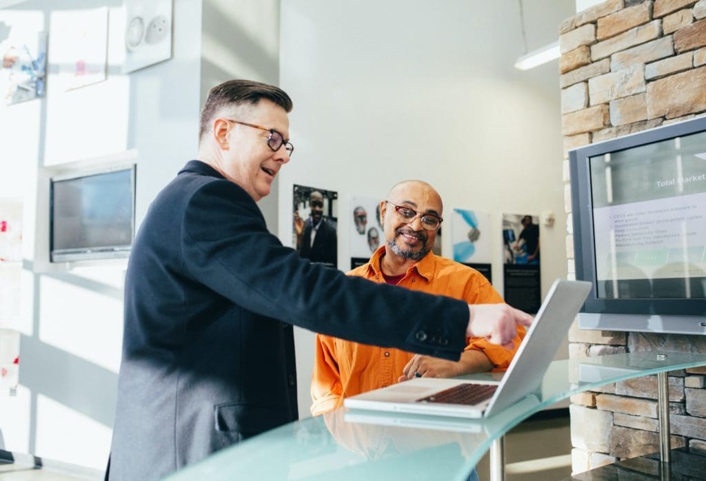 A manager discussing something with a service technician