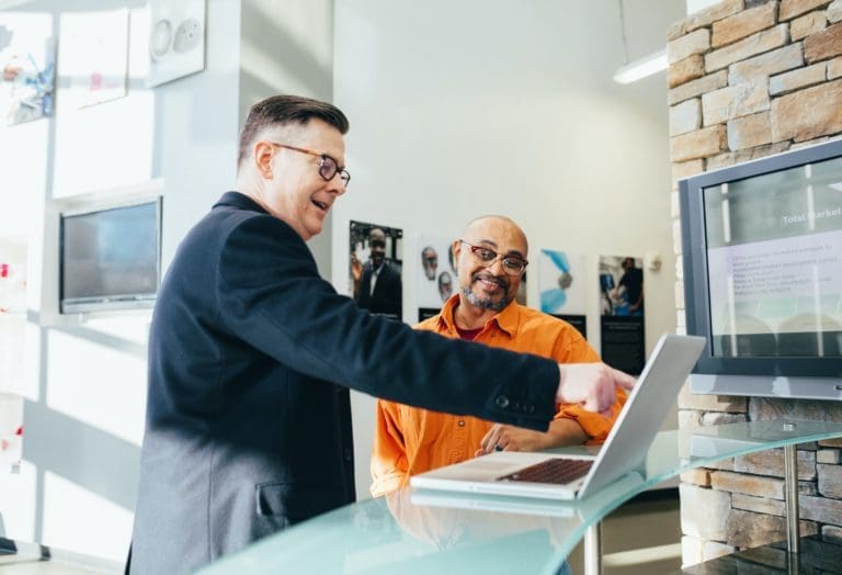 A manager discussing something with a service technician