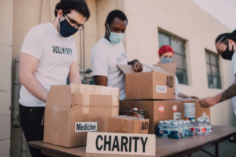 Nonprofit groups packing boxes for charity