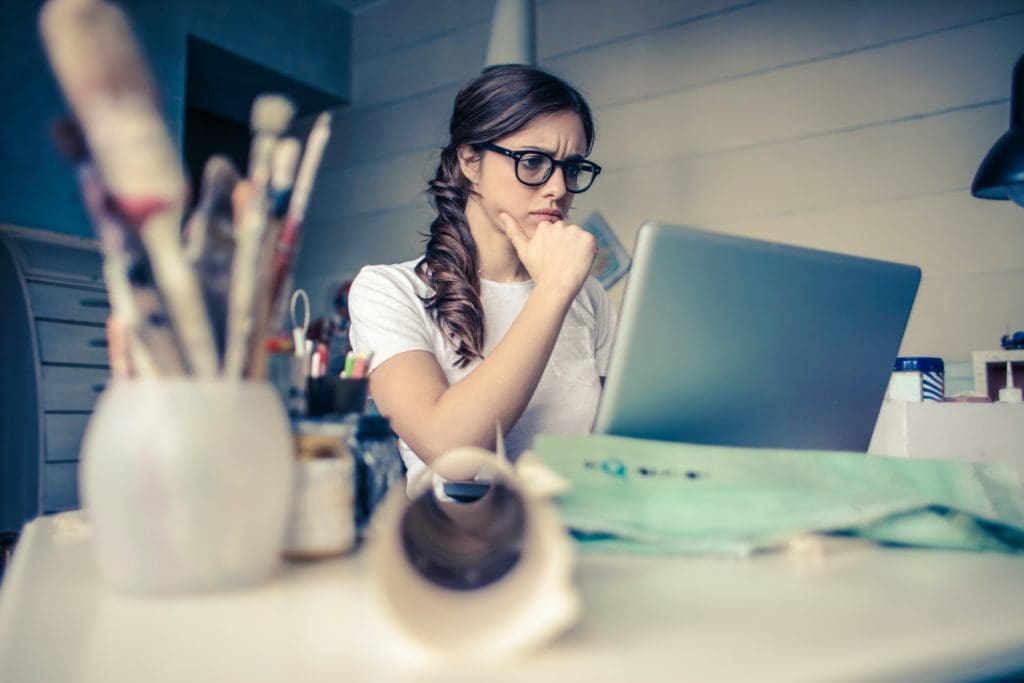 An accounting seriously thinking in front of a computer