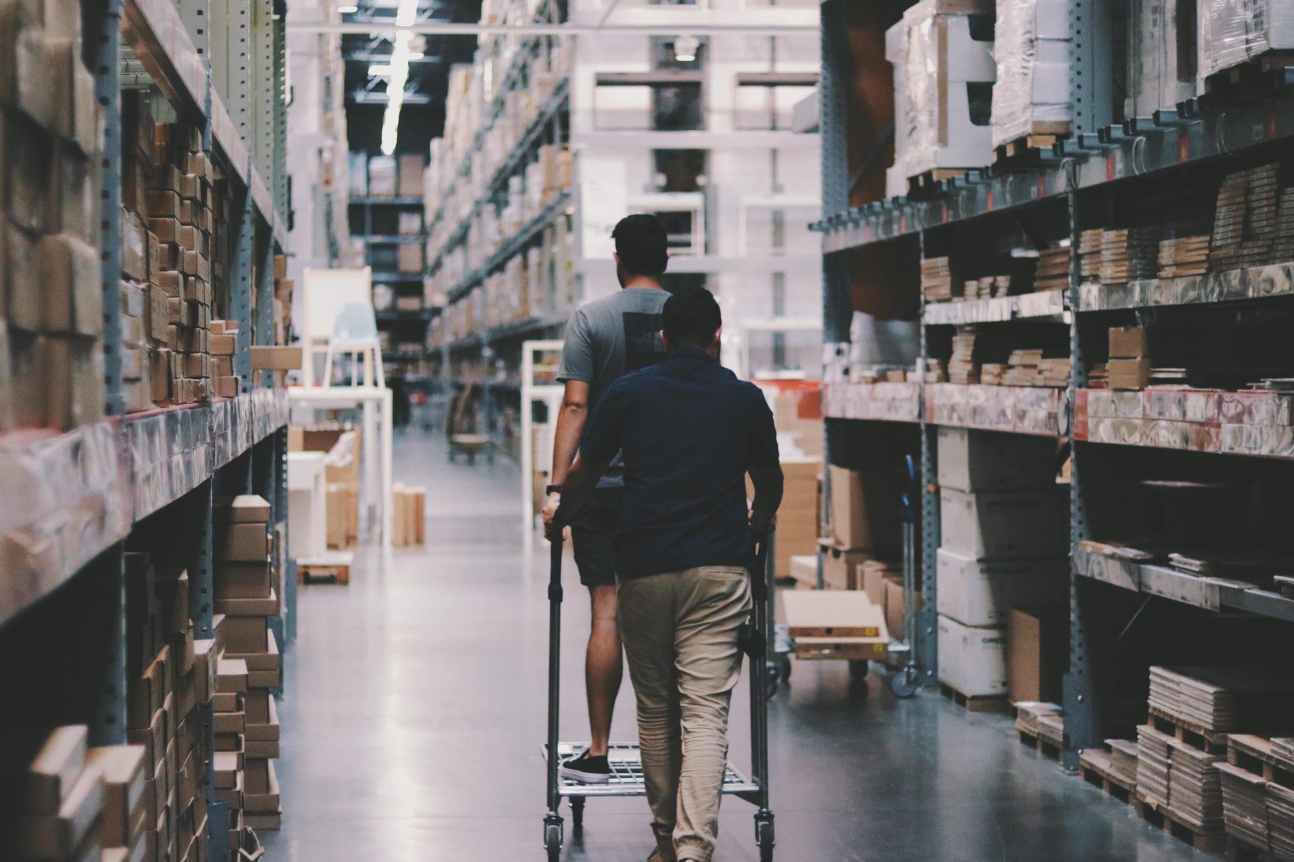 Team members working on inventory items in a warehouse