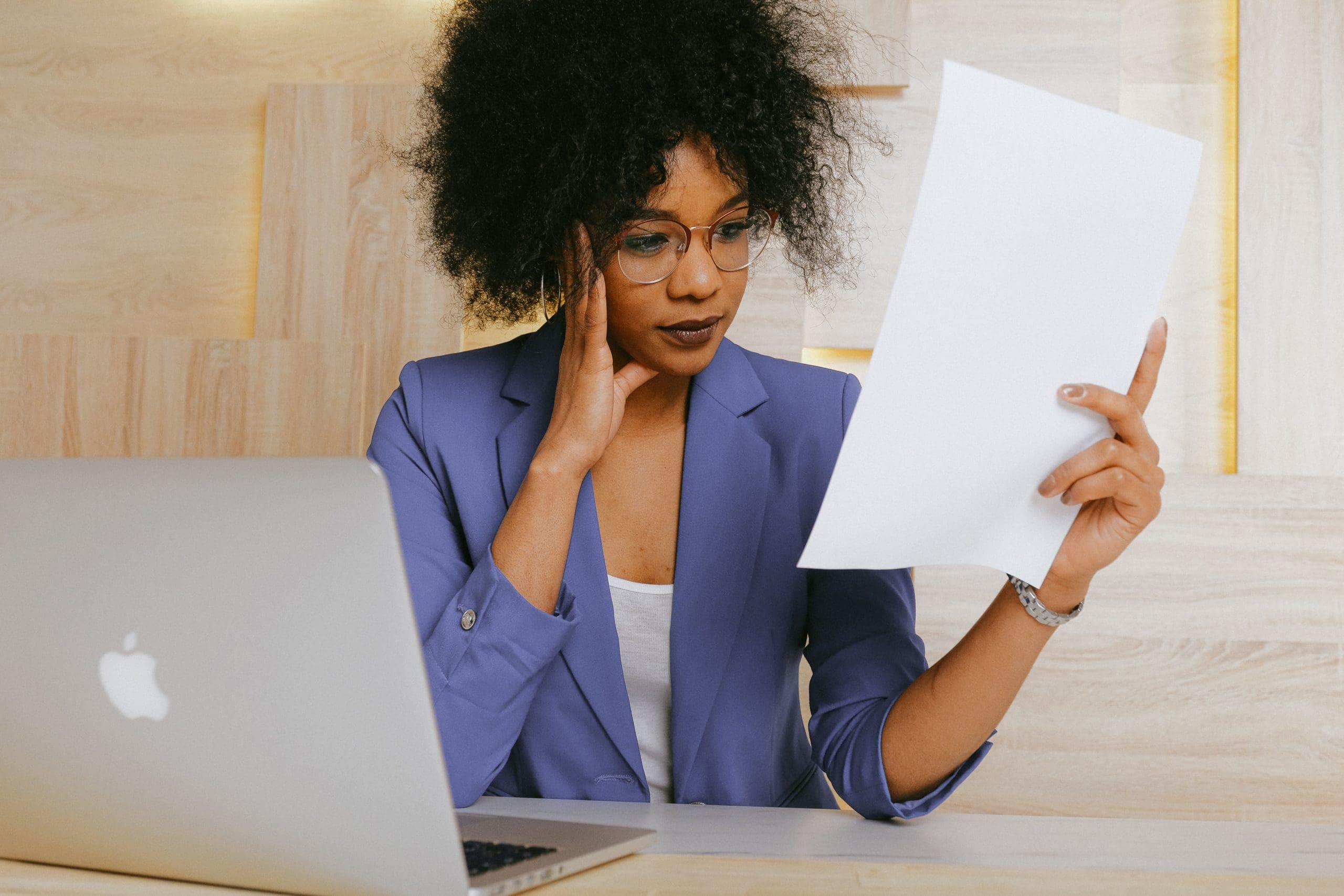 Business owner checking a sales receipt created in QuickBooks