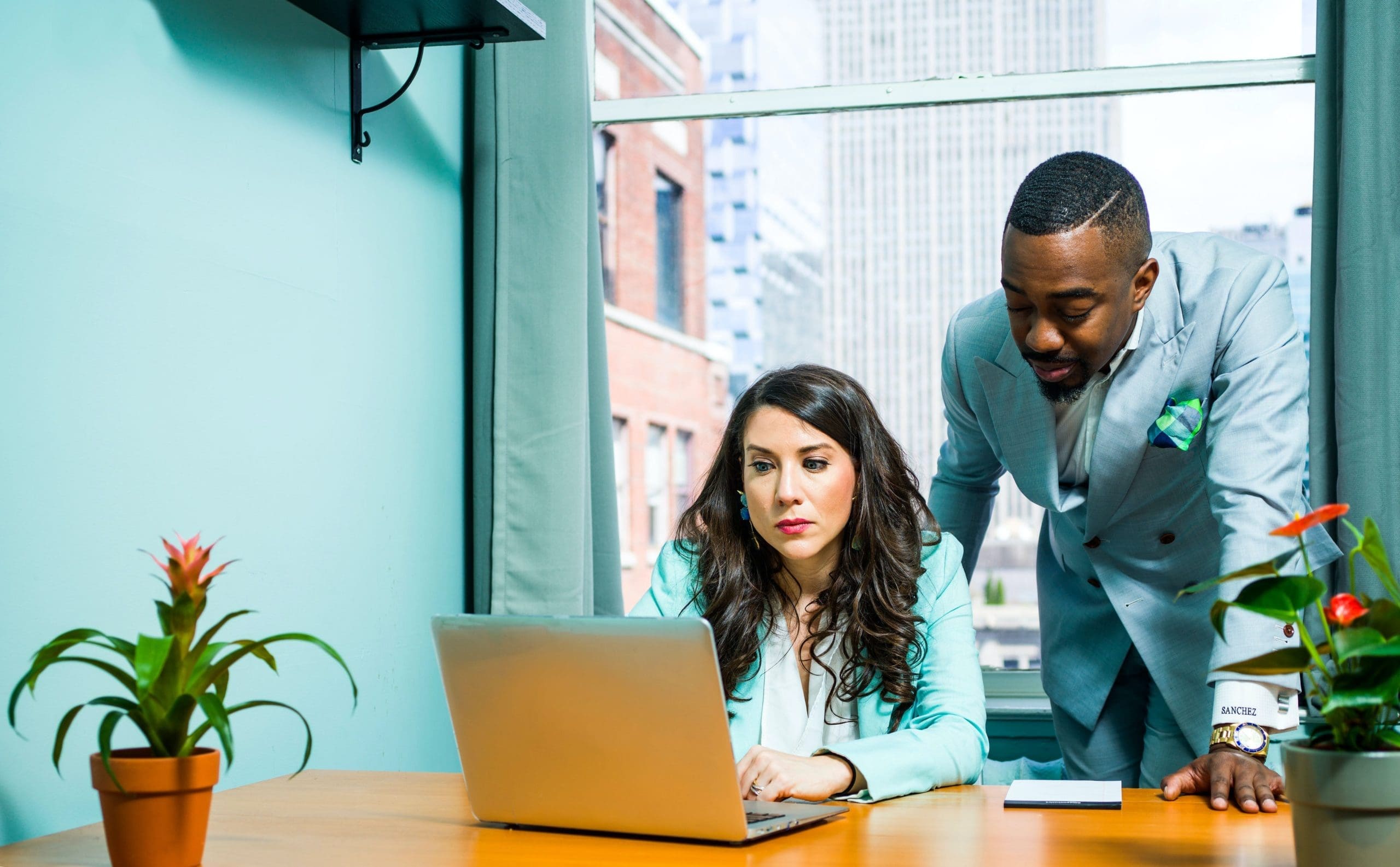 Accountant helping a business owner connecting bank account to QuickBooks