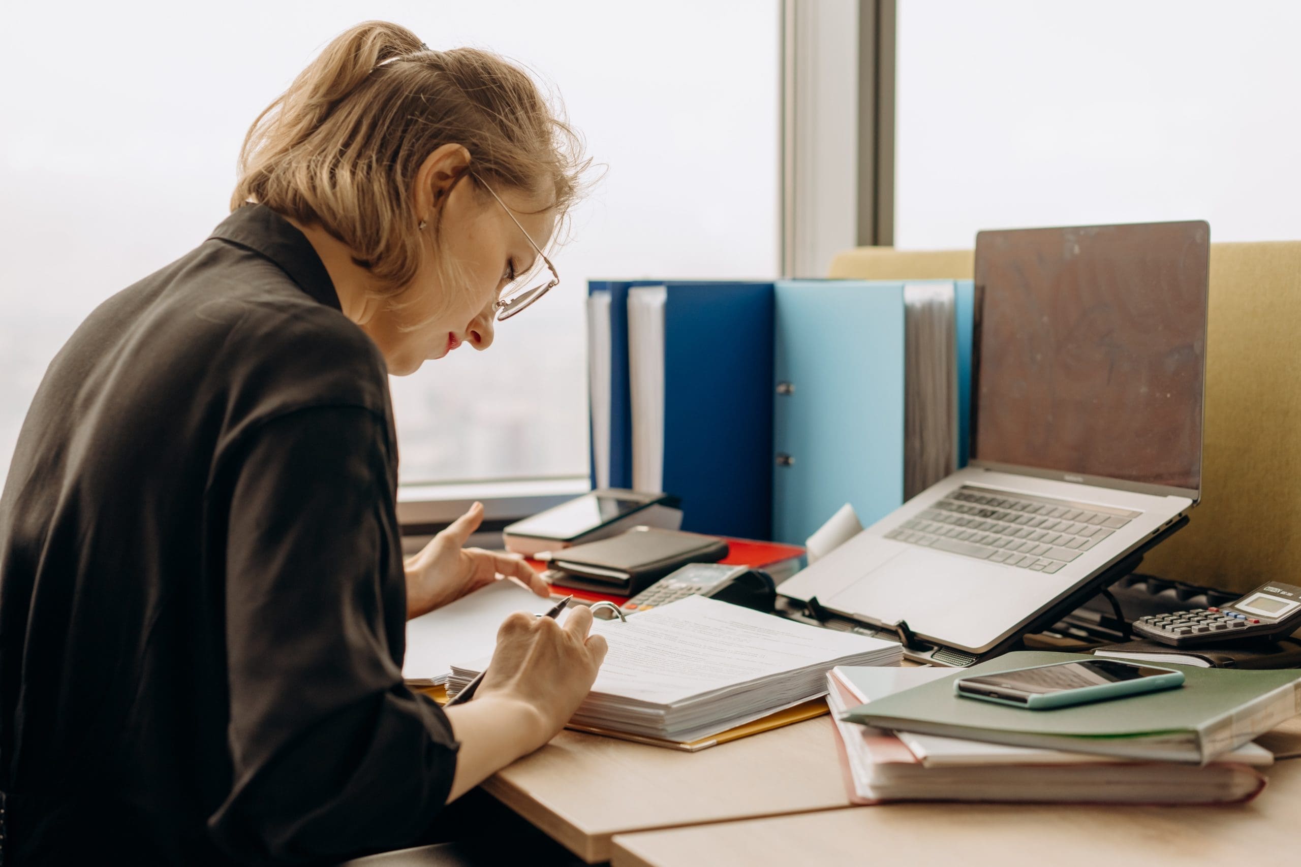 Accountant checking files of transactions to import to QuickBooks