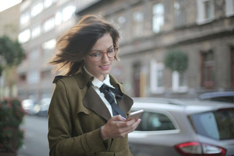 Businessman checking out payment transactions through the QuickBooks GoPayment mobile app