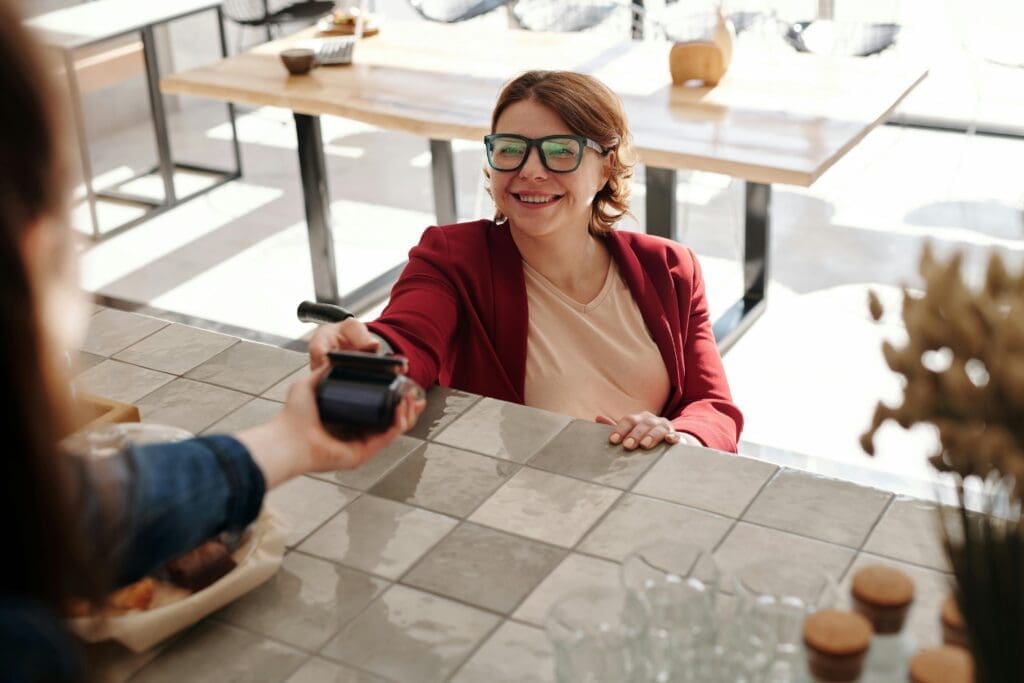 Customer making a payment through a card reader