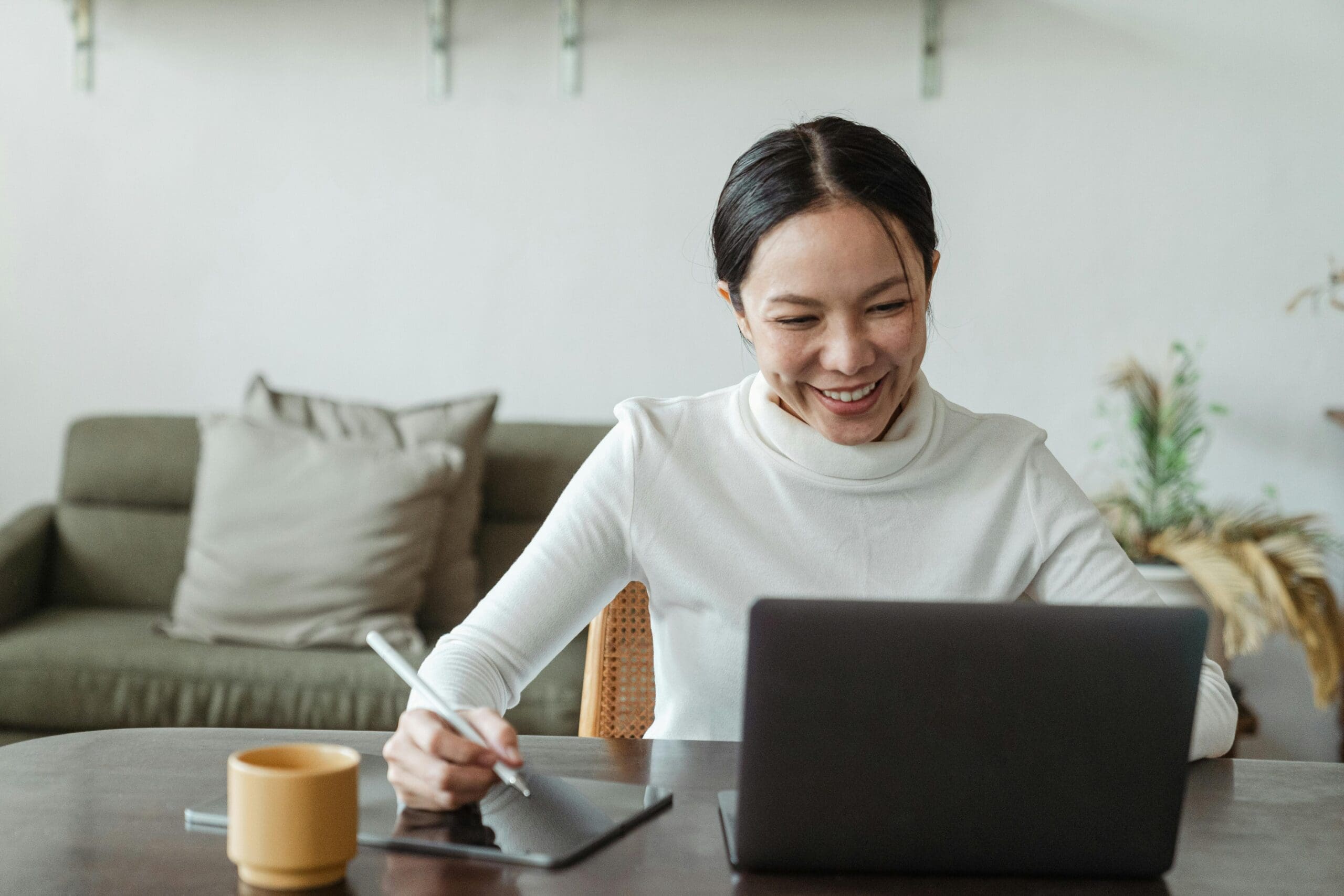 Happy business owner using QuickBooks Time