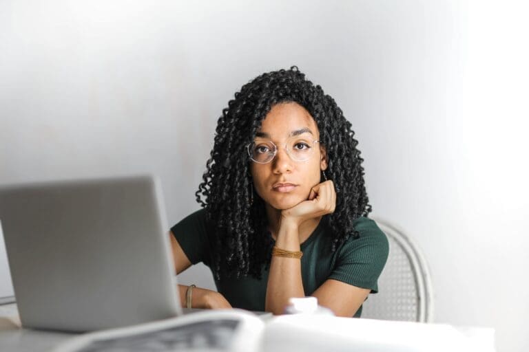 Woman sitting in front of a laptop