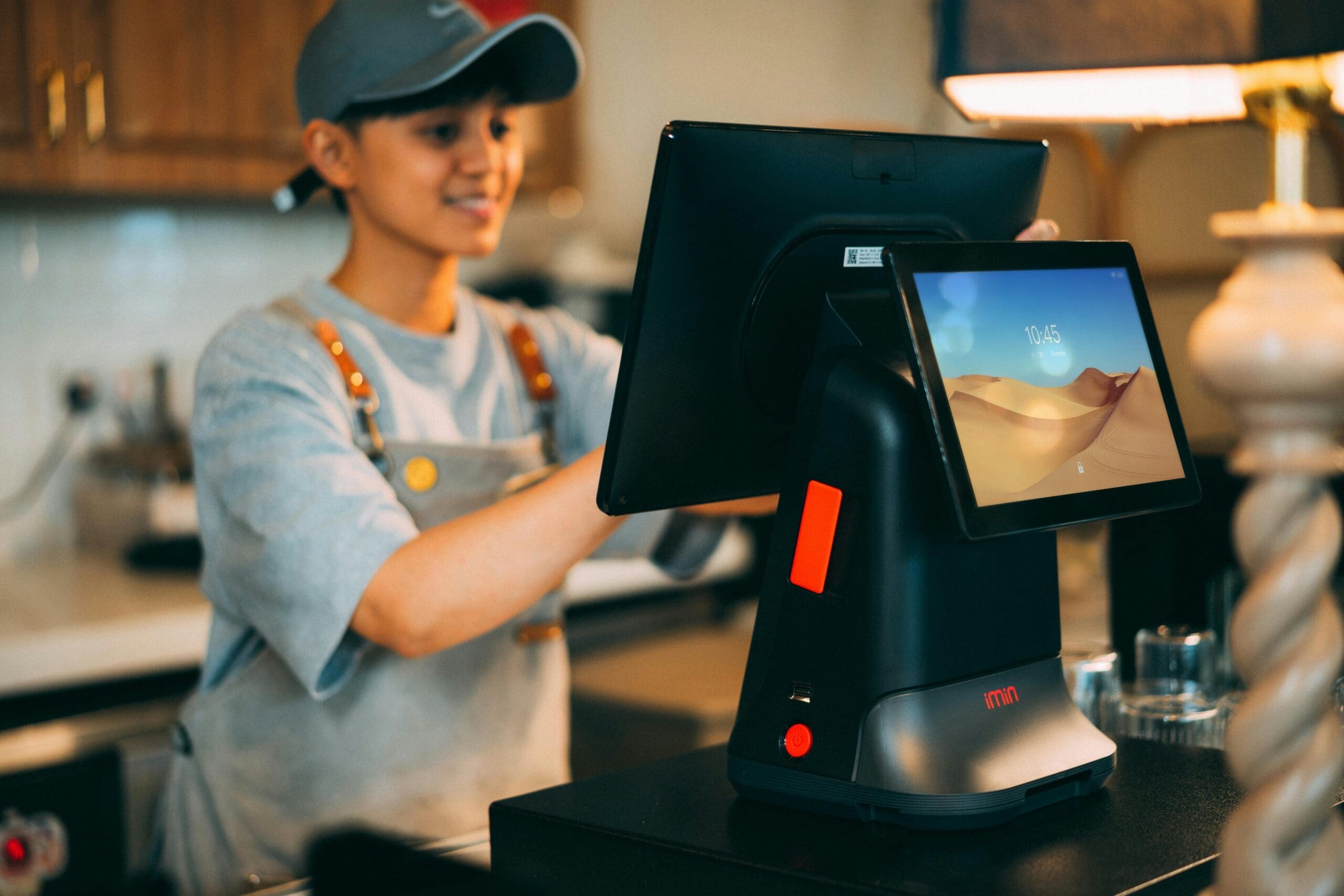 Retailer entering data on a POS machine