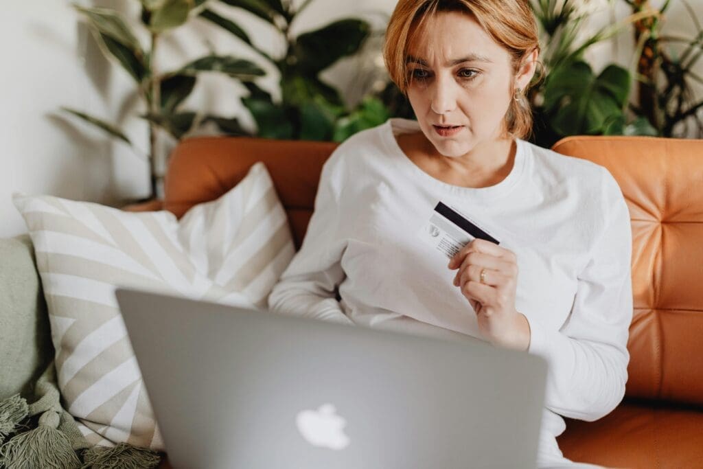 Woman using credit card for payment