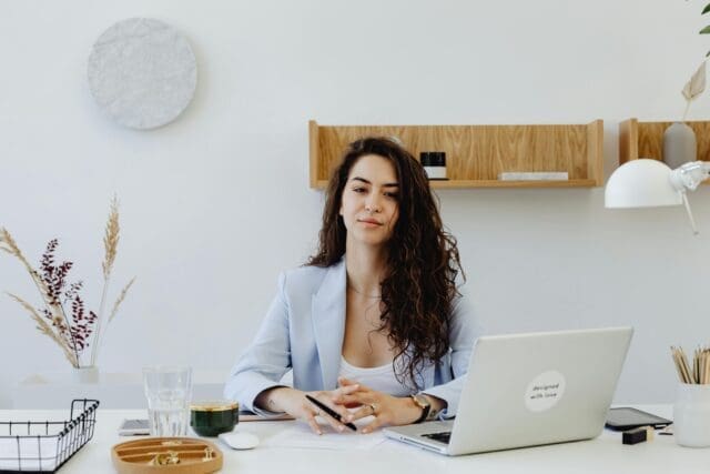 Business woman sitting in front of a laptop