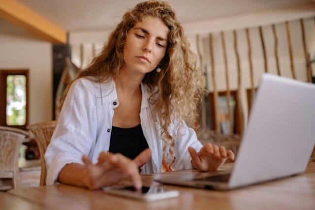 Businesswoman typing something on her phone